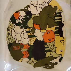 Woven tapestry originally for John Deere tractor seat cover.